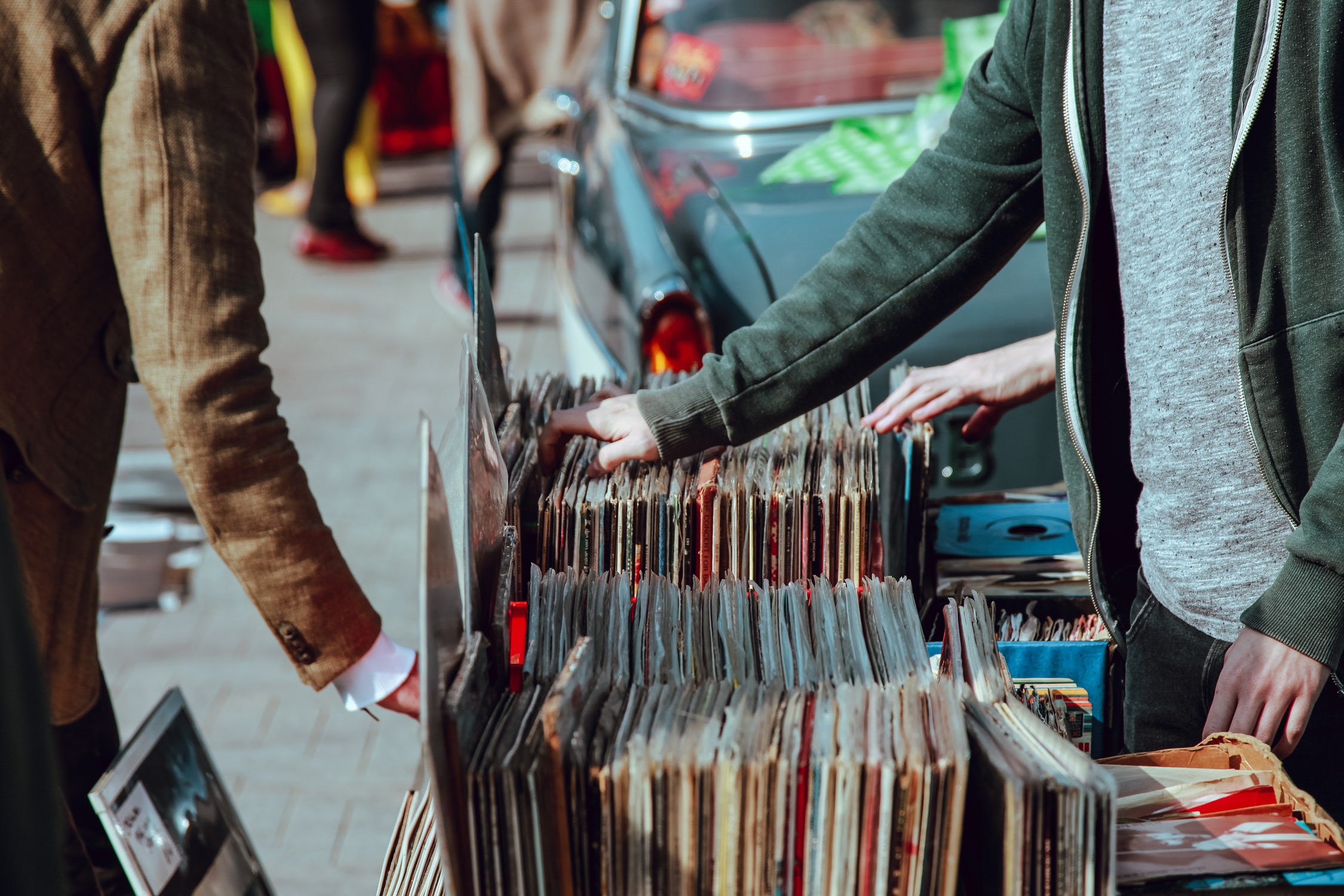 People browsing vinyl records at a stall on the street.jpg-499.2kB